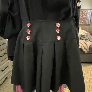 Hot Topic skirt with suspenders, mushroom button detail.